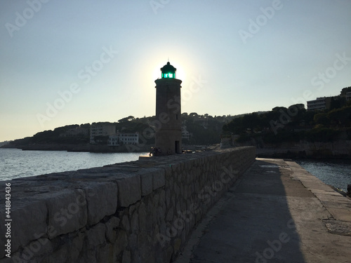 The Cassis lighthouse situated on the pier at the harbour's entrance on a summer sunny day, located in the Provence-Alpes-Côte d'Azur region, on the French Riviera in Southern France.