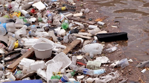 Plastic bottles and garbage in flooded water