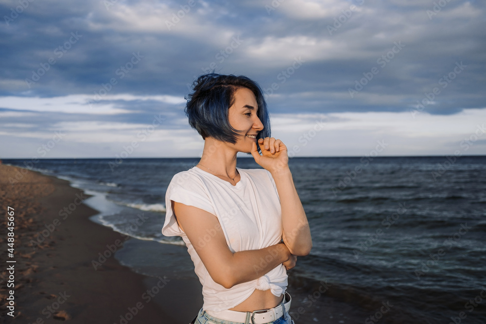 Active healthy young woman enjoying a sandy baltic beach. Active healthy young woman enjoying a sandy baltic beach.