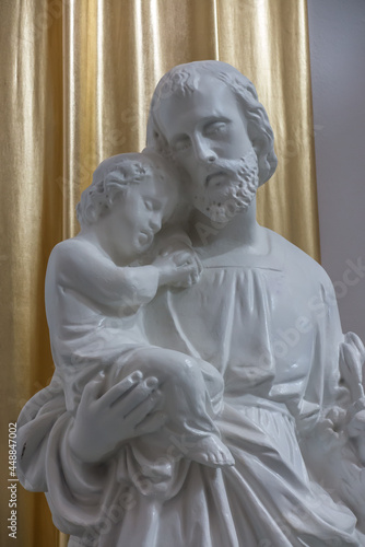 Chelm, POLAND - July 5, 2021: Inside the shrine, the Basilica of Virgin Mary in Chelm in eastern Poland. The figure of St. Joseph with Jesus in his arms