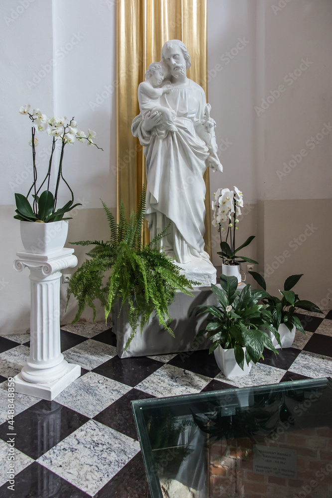 Chelm, POLAND - July 5, 2021: Inside the shrine, the Basilica of Virgin Mary in Chelm in eastern Poland. The figure of St. Joseph with Jesus in his arms