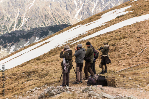 A few people taking photos of the Tatra Mountains  in Poska photo