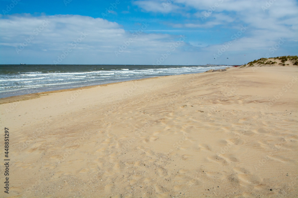 Yellow sandy beach in small Belgian town Knokke-Heist, luxury vacation destination, summer holidays
