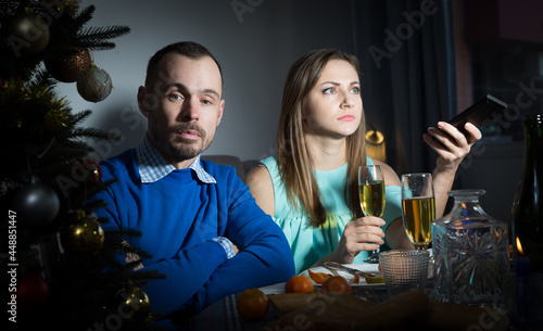 Quarrel couple having dinner at Christmas night at home