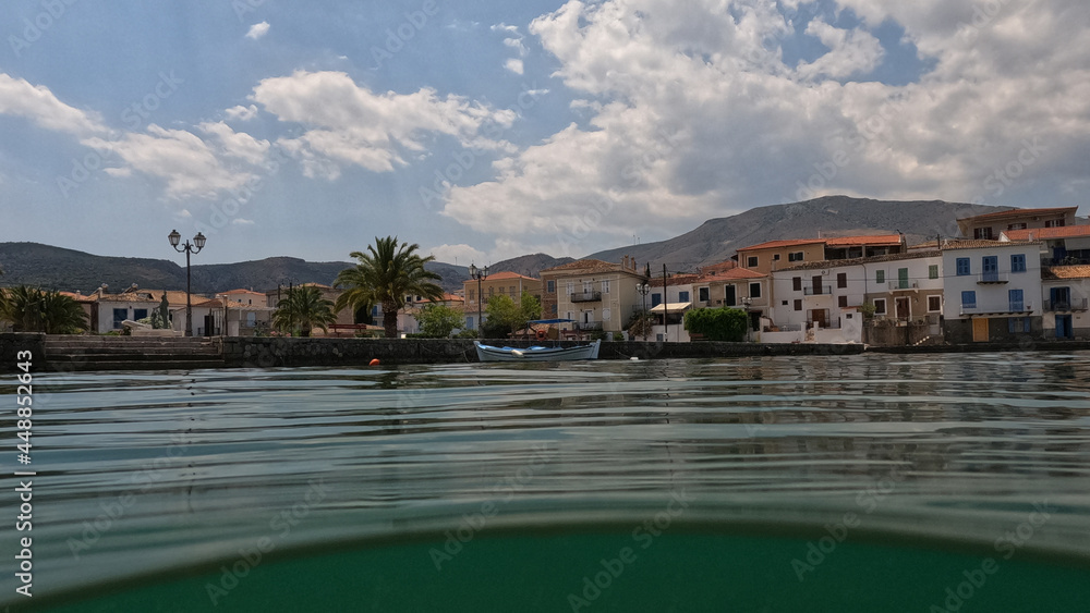 Underwater split photo of picturesque  fishing village of Galaxidi with beautiful neoclassic houses and marine history, Fokida, Greece
