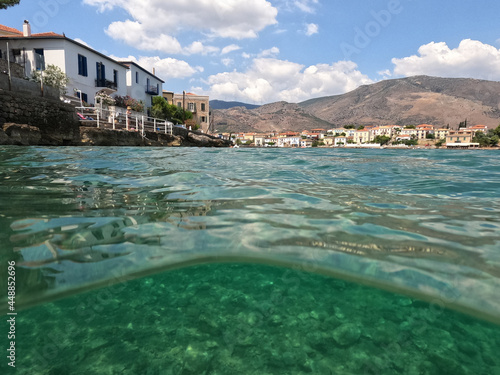 Underwater split photo of picturesque  fishing village of Galaxidi with beautiful neoclassic houses and marine history, Fokida, Greece © aerial-drone