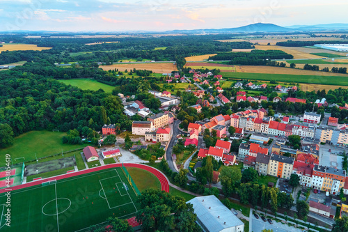 Fototapeta Naklejka Na Ścianę i Meble -  Small town in Europe, aerial view. Residential buildings and streets in small city