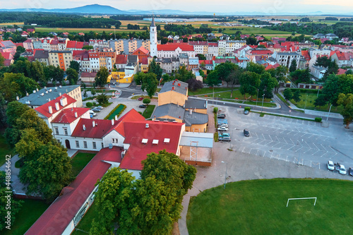 Fototapeta Naklejka Na Ścianę i Meble -  Small town in Europe, aerial view. Residential buildings and streets in small city
