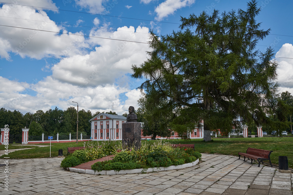 Russia. The town of Yaropolets. The courtyard of the Zagryazhsky-Goncharovs Estate. Monument to Alexander Pushkin against the background of the gate to the park