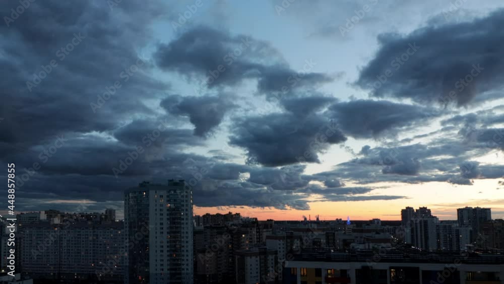 Timelapse of clouds floating over the city at sunset Timelapse of clouds floating over the city at sunset