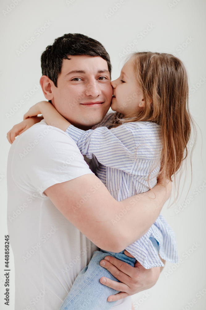 little daughter cuddling and having fun with dad. Happy family. little daughter cuddling and having fun with dad. Happy family.