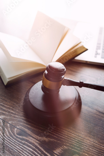 Business and lawyers discussing contract papers with brass scale on desk in office. Law, legal services, advice, justice and law concept picture with film grain effect