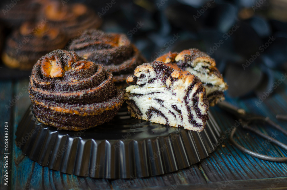 Fototapeta premium Puff buns with poppy seeds and sugar