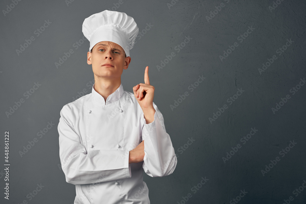 chef with a cap on his head gesturing with his hands work profession chef with a cap on his head gesturing with his hands work profession