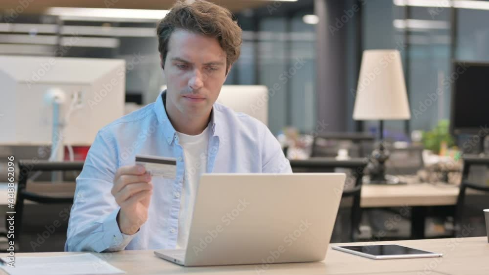 Man making Successful Online Payment on Laptop Man making Successful Online Payment on Laptop