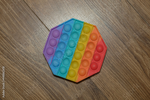 Rainbow Pop it fidget toy on the table photo