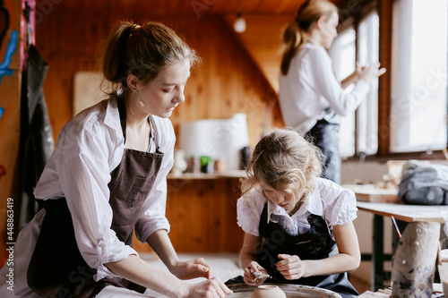 Craftswoman providing master class in workshop  photo