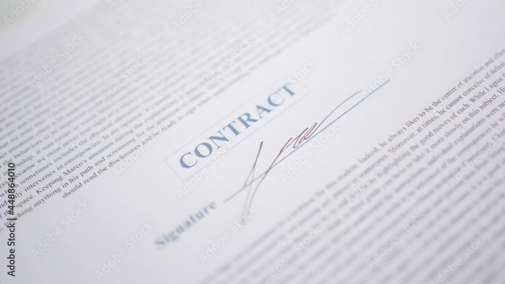 Signing a Contract Document With a Pen closeup Signing a Contract Document With a Pen closeup