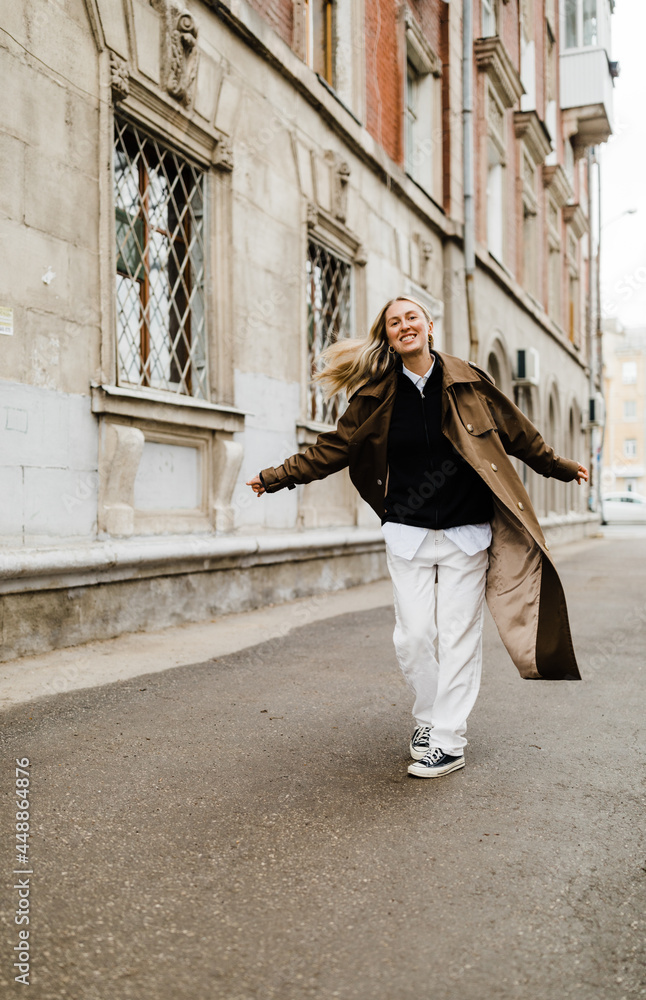 street portrait of happy blond woman street portrait of happy blond woman