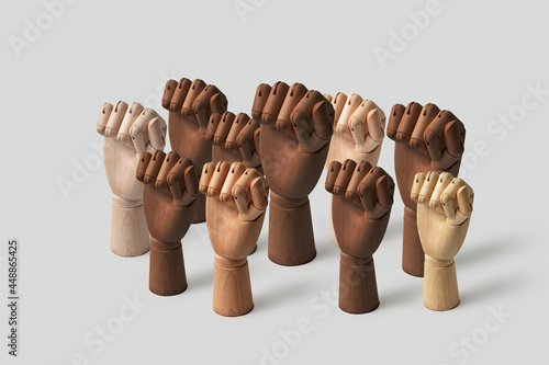 Different wooden hands with fists up
