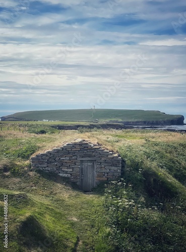 Fisherman Hut at Skiba Geo with Brough of Birsay in the distance. photo