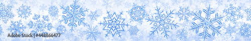 Banner of big complex translucent Christmas snowflakes in blue colors  isolated on transparent background. With seamless horizontal repetition