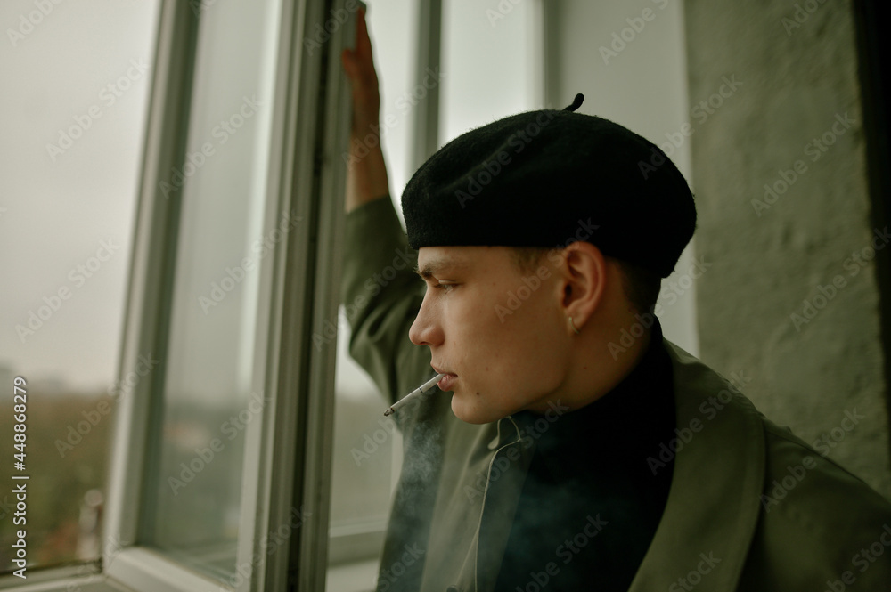portrait of a young guy in a black beret portrait of a young guy in a black beret
