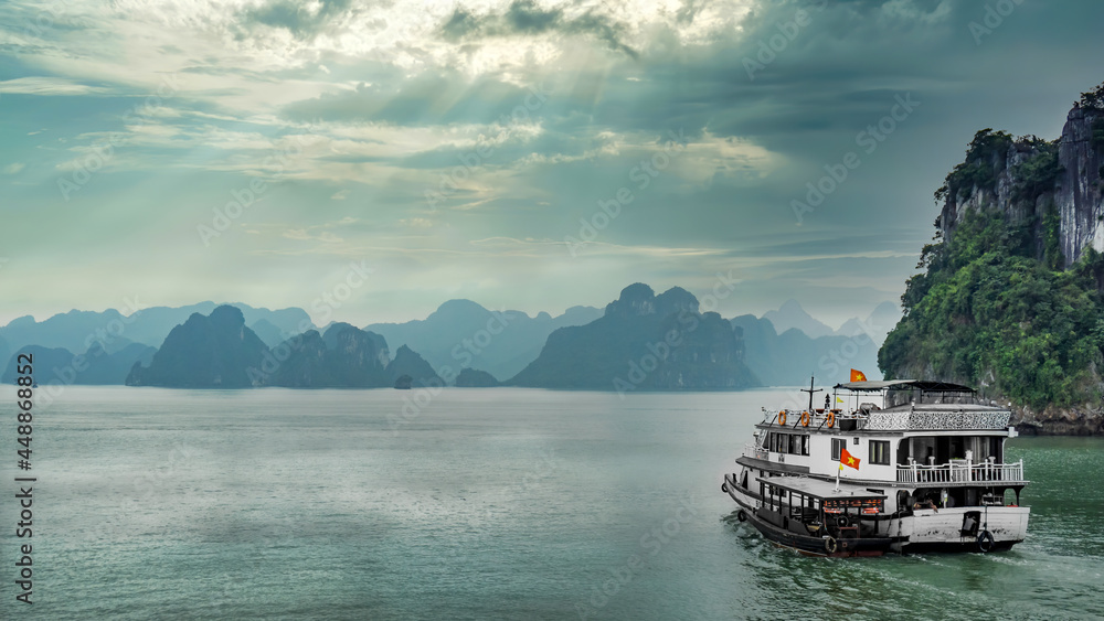 Halong Bay, Vietnam - December 2015: Cruise boat sailing in Halong Bay. Halong bay is a famous destination of Vietnam