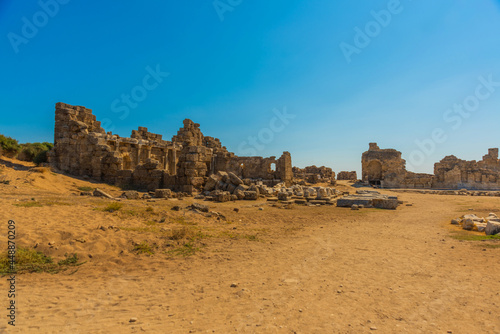 SIDE, TURKEY: Ancient ruins in the city of Side on a sunny summer day against the background of the blue sky.
