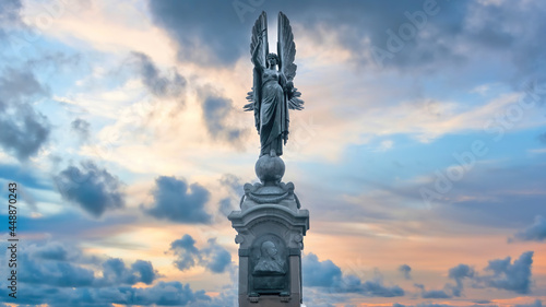 Brighton and Hove, Sussex, UK - January 2019: Peace Statue in Brighton and Hove during sunset under dramatic clouds photo