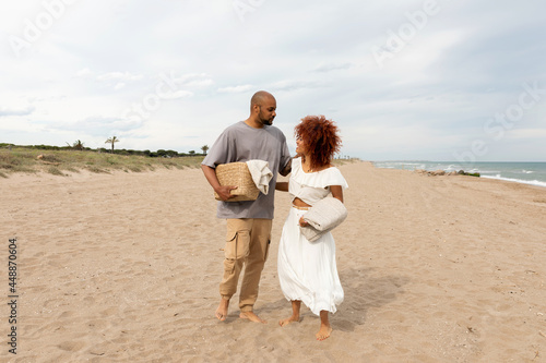 lovely couple walking by the beach photo