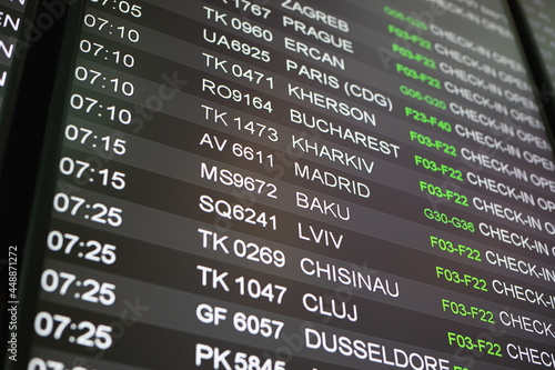 screen with departure flights in airport, Madrid Baku Lviv