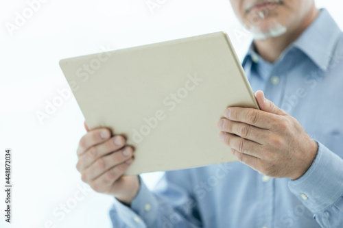 Businessman holding a tablet-pc in his hands © Giulio_Fornasar