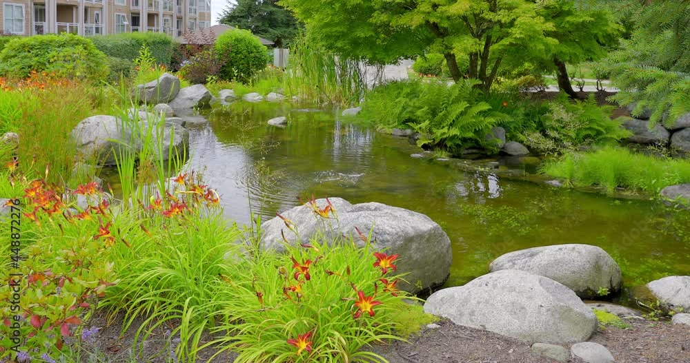 Establishing shot of nice water landscape and green background in Vancouver, Canada, North America. Day time on June 2021. Still camera view. ProRes 422 HQ. Establishing shot of nice water landscape and green background in Vancouver, Canada, North America. Day time on June 2021. Still camera view. ProRes 422 HQ.
