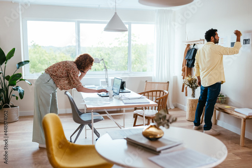 Diverse colleagues working in light workplace