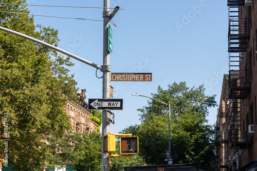 New York, NY - USA - July 30, 2021: A street sign for Christopher Street; in the West Village neighborhood of Manhattan. Famous for the Stonewall Inn and the beginning of Gay Rights Movement. photo