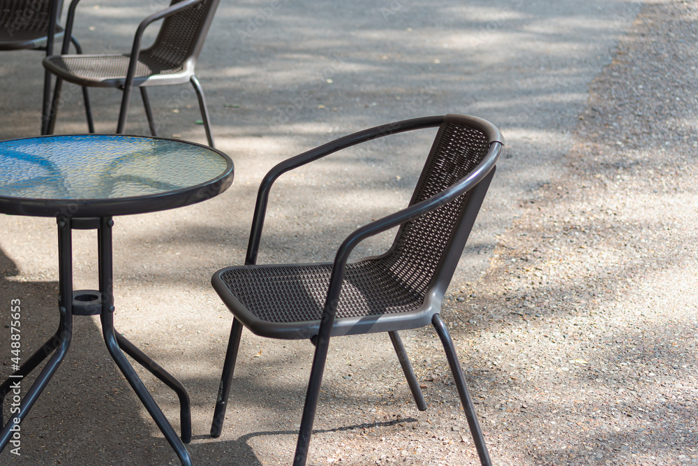 Glass table and chair in a cafe on the street. Glass table and chair in a cafe on the street.
