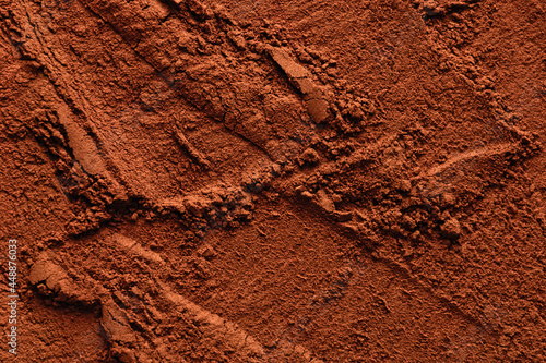 Natural cocoa powder textured background, copy space