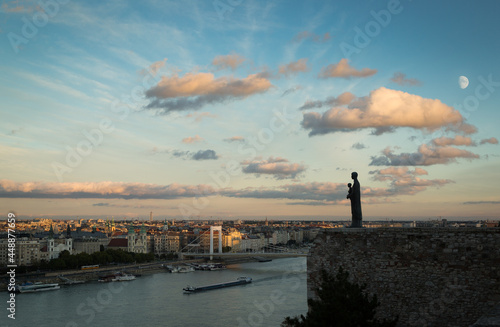 Late evening panorama of Budapest with Mother Mary statue. photo