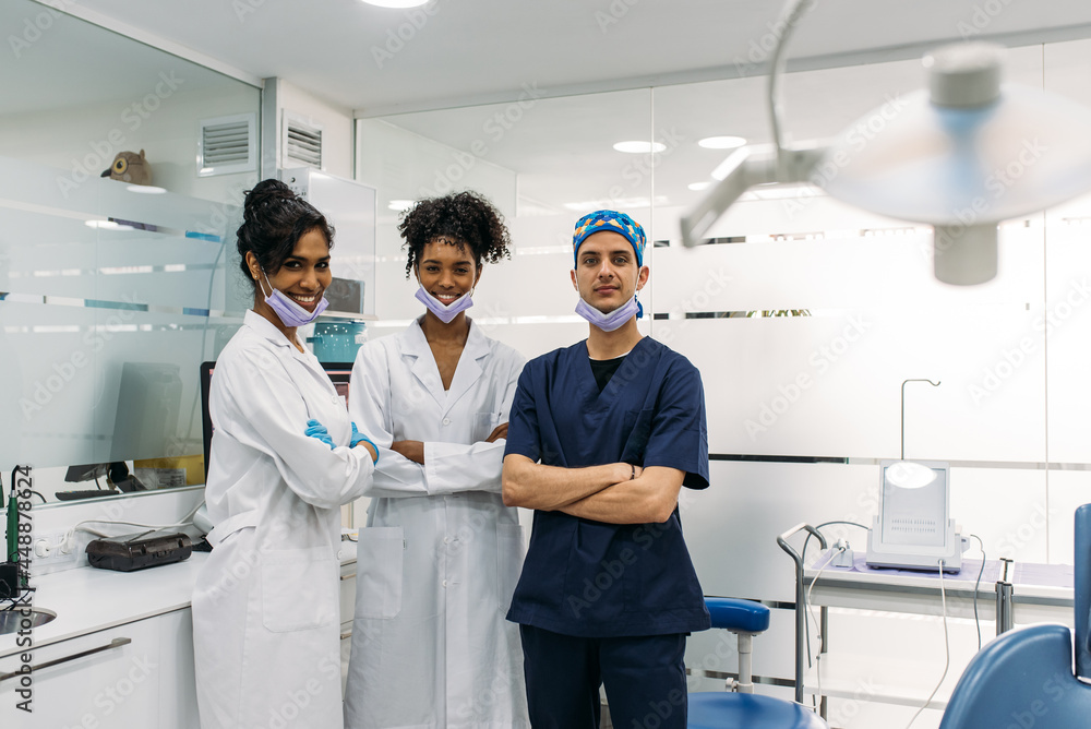 Happy diverse dentists in dental clinic Happy diverse dentists in dental clinic