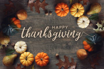 Happy Thanksgiving Fall Season Holiday Calligraphy Script Text Card Design with Festive Autumn Pumpkin, Leaf and Fruit Border Over Rustic Wood Texture Background