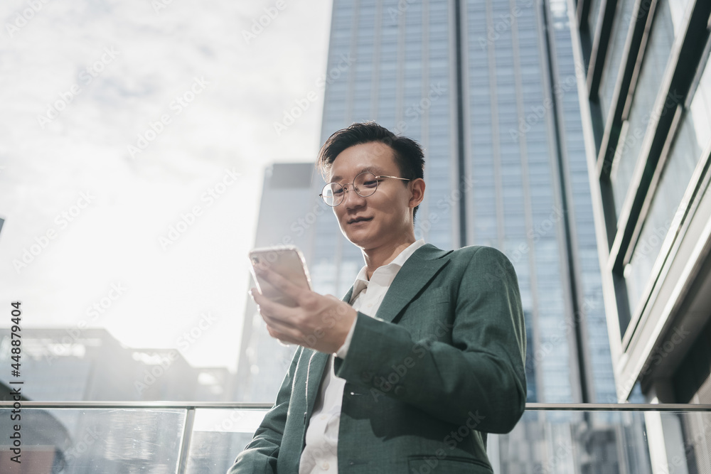 A man playing cellphone A man playing cellphone