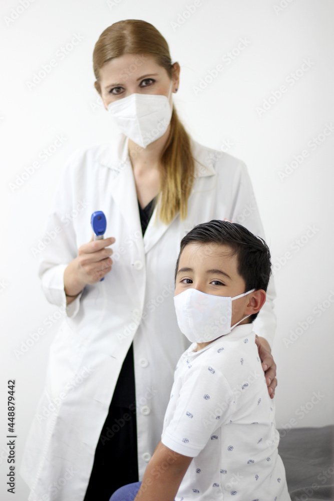 Female professional pediatrician doctor working checking a happy latin child
Female professional pediatrician doctor working checking a happy latin child