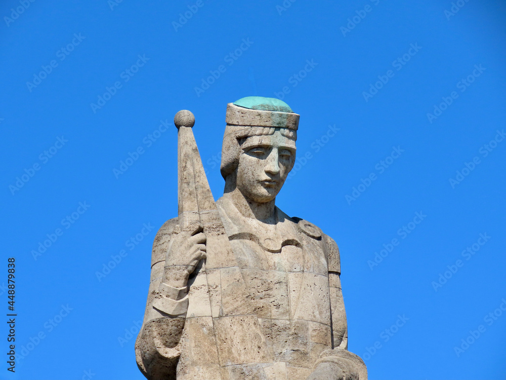 Military Cemetery in Riga. Close up of central sculpture 'Mother Latvia'. Sunny spring day
