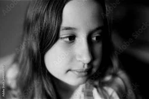 Close up portrait in black and white of a beautiful young girl photo