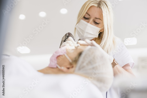 Cosmetologist doing micropigmentation