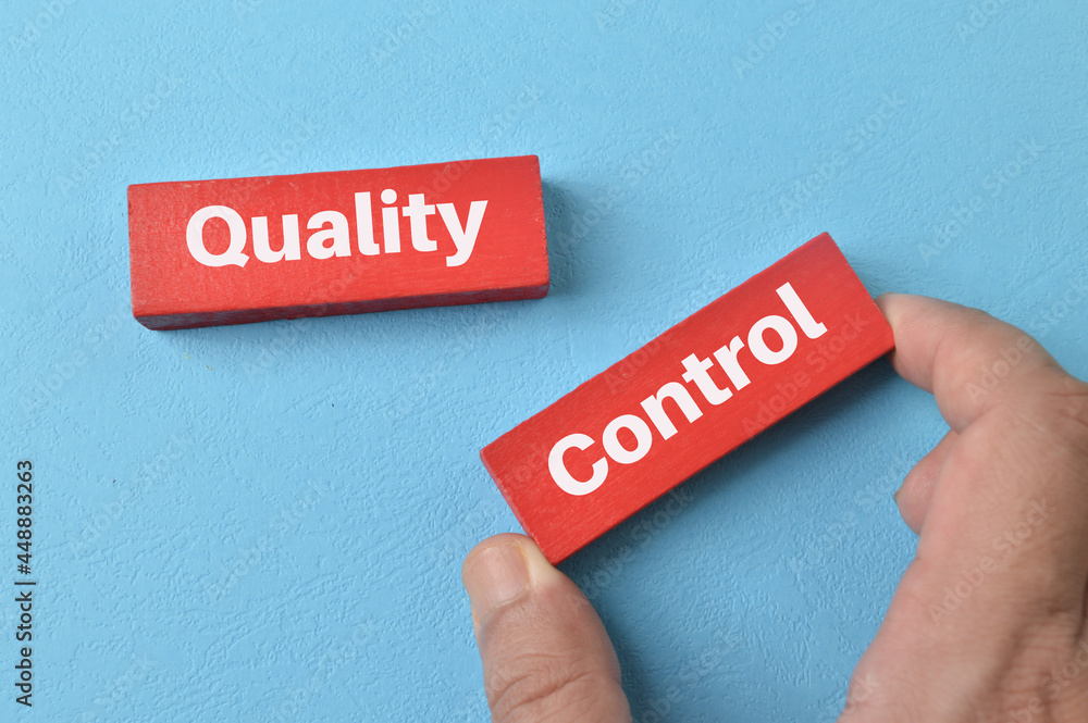 Red wooden blocks with text QUALITY CONTROL Red wooden blocks with text QUALITY CONTROL