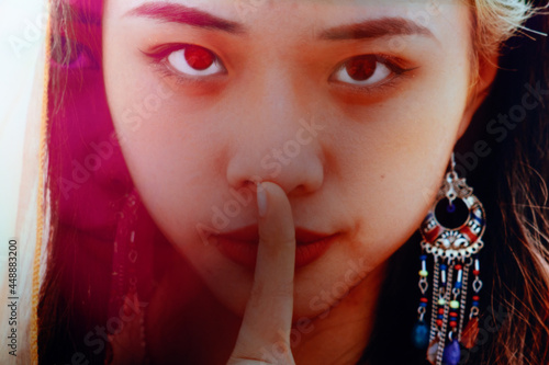 fashion girl making keep quiet gesture