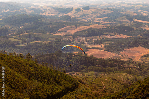 parachute flying over mountains of the city of Poços de Caldas, Brazil