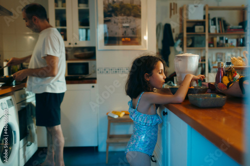 Little mermaid stealing food from kitchen photo